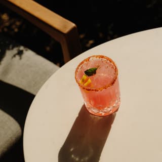 The Las Casitas cocktail, with tequila Cointreau, citrus and vanilla, and a stunning pink pomegranate blush, seen from above.