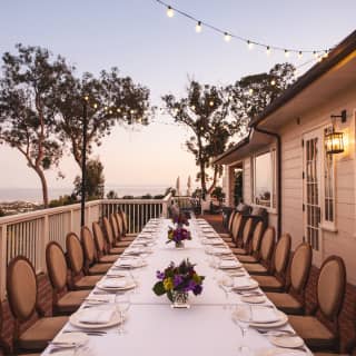 Banquet table on a balcony overlooking Santa Barbara at sunset