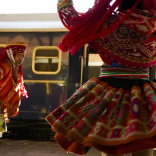 Close-up of a Peruvian entertainer's wool skirt as she dances, spinning with kaleidoscope patterns in red, green and yellow.