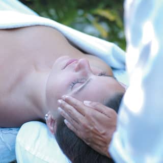 close up of a woman receiving a facial massage