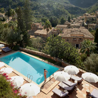 Aerial view of a hotel pool overlooking the Tramuntana mountains