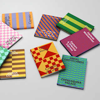 Nine books lie scattered on a surface, with geometrically patterned two-tone covers and titles pertaining to Belmond hotels.