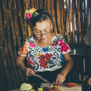 Chef Rosalia Chay Chuc demonstrates traditional Mayan cooking techniques with ingredients gathered locally