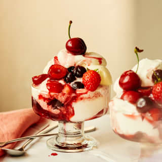 Two bowls of sumptuous Paciugo Gelato, layered with ice-cream, whipped cream, summer berries and sour Amarena cherries.