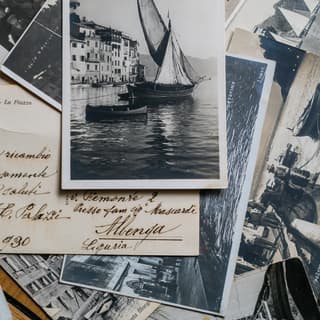 Old black-and-white photos and handwritten notes telling the story of Portofino’s Splendido Mare Hotel