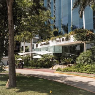 Exterior of Miraflores Park Hotel among leafy gardens
