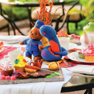 Cuddly toys and colourful cakes create a memorable afternoon tea for younger guests