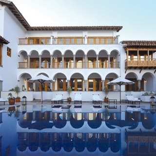 Hotel infinity pool in an elegant hotel courtyard