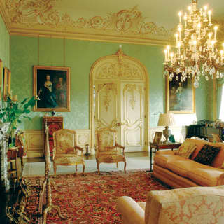The drawing room of the Downton Abbey location, Highclere Castle, lavishly decorated with acres of gilt and giant chandelier