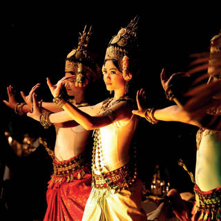 Women dressed in traditional Cambodian garb and performing a dance
