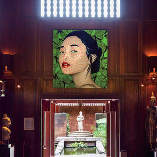 Large contemporary portrait of a Cambodian woman in a wood-panelled room