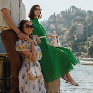 Three people enjoying their day with Portofino Harbour in the background