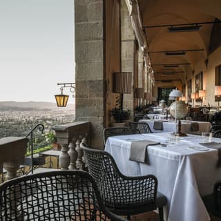 Formal restaurant in an open-air cloister with views over Florence