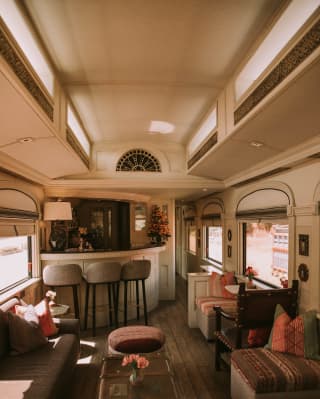 The bar, stools, sofas and tables in the Lounge Car