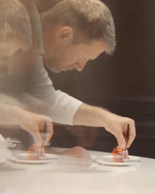 Long exposure shot of Pastry Chef Benoit Belin as he prepares a sweet treat for an Afternoon Tea at The Cadogan Lounge.