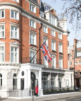 Exterior of The Cadogan with a Union Jack flying from a flagpole