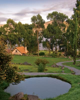 The hotel’s gardens and ponds in a glorious landscape next to a mysteriously misty Colca Canyon