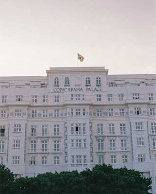 The art deco facade of Copacabana Palace with the hotel name in gold lettering