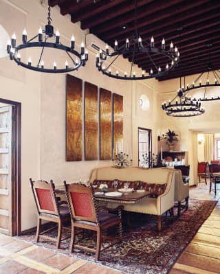Light and elegant restaurant with Mexican artwork on the walls