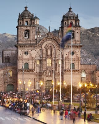 Ornate Spanish colonial church at sundown in Cusco