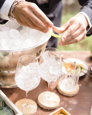 a barman making a cocktail in a garden