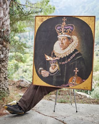 Oil painting on an easel of a Spanish king wearing a purple and gold crown