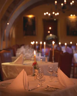 Candles create a relaxed atmosphere under the old stone arches of the El Tupay restaurant