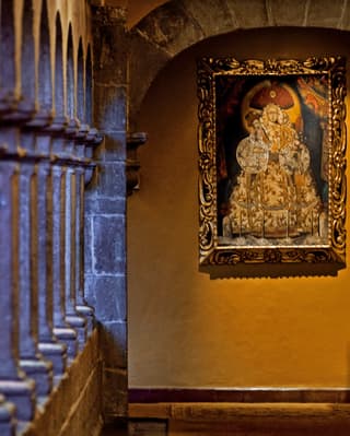 Original religious artwork in one of the old monastery’s atmospheric stone corridors