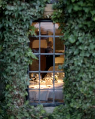 view of a dining table through outside window