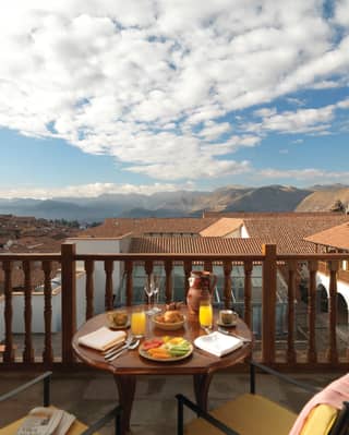 Breakfast served on the balcony overlooking the view of Cusco town