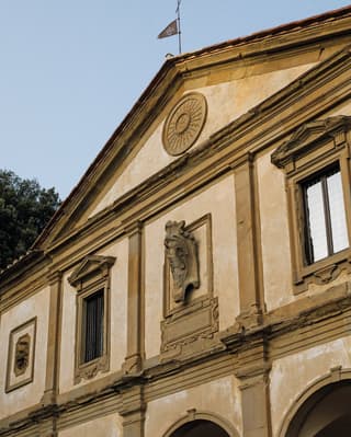 Close-up of the classical sandstone porticoed exterior of Villa San Michele