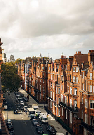 The ornamental gables and terracotta chimney pots of Pont Street Dutch houses crowd the London skyline