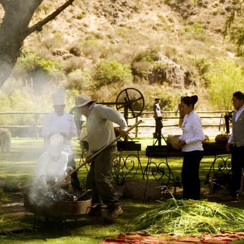 Cooks and gardeners working in the Hotel Rio Sagrado gardens