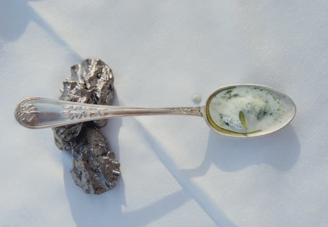 A taster of the classic Venetian dish, baccalà mantecato – creamed cod – sits on a silver spoon on a white table cloth