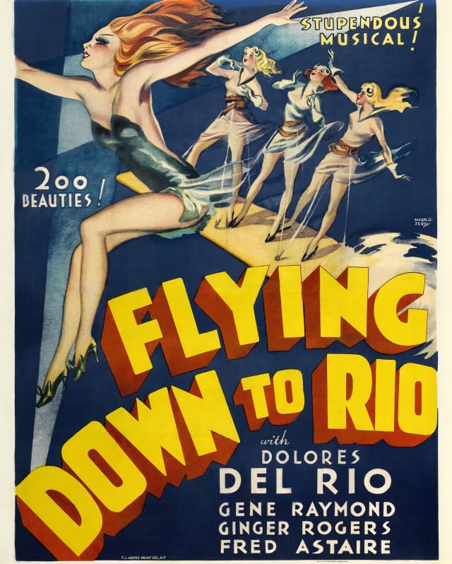 Film poster with Flying Down to Rio in bold yellow and red lettering, actors' names in white and Art Deco drawings of girls.