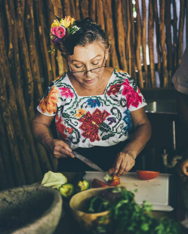Chef Rosalia Chay Chuc demonstrates traditional Mayan cooking techniques with ingredients gathered locally