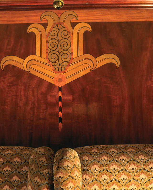 Classical Roman-style design in marquetry on a French-polished wooden wall panel