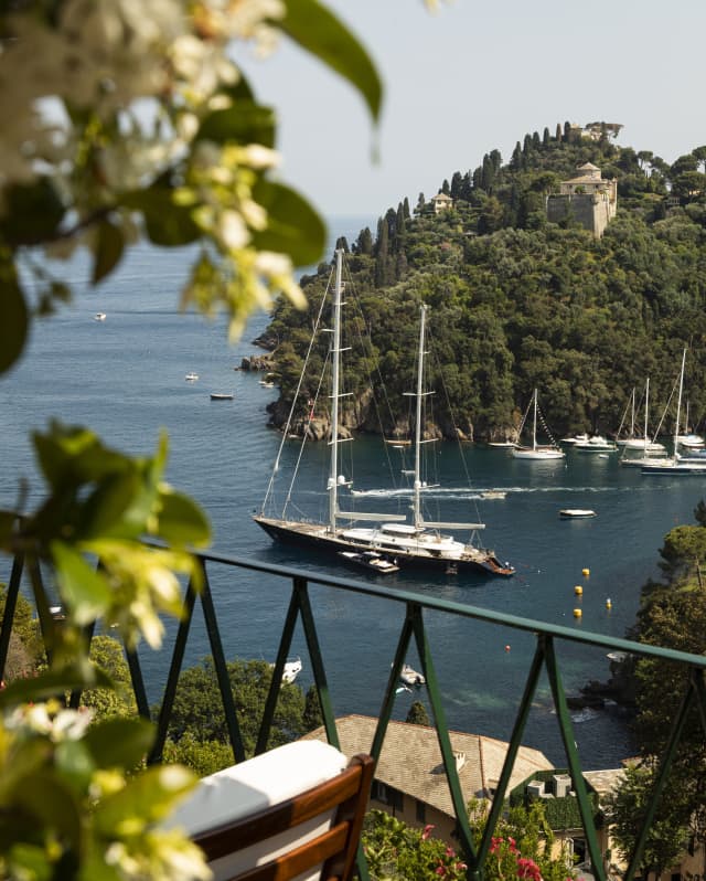 Fringed by clematis, the balcony stands above a steep hillside, giving uninterrupted views of Portofino Harbour and its yachts