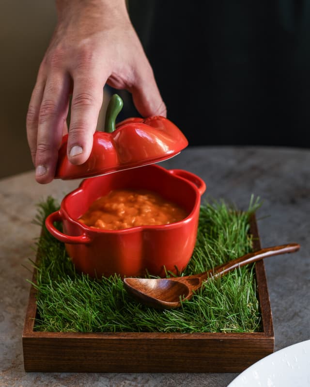 Alessandro Cozzolino’s bell pepper risotto is served in a dish shaped like a red pepper, the green stem forming part of the lid